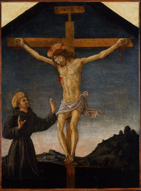 Christ on the cross with Saint Francis off to the left.